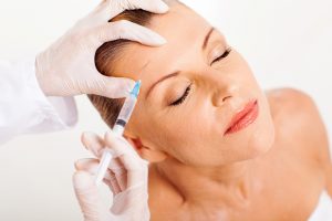 doctor giving face lifting injection