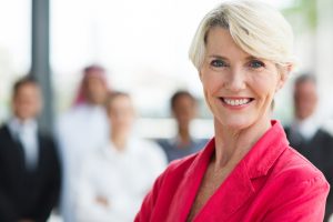 happy senior businesswoman looking at the camera