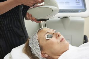 Beautician Carrying Out Intense Pulse Light Treatment