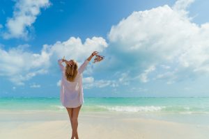 Woman in bikini at tropical beach