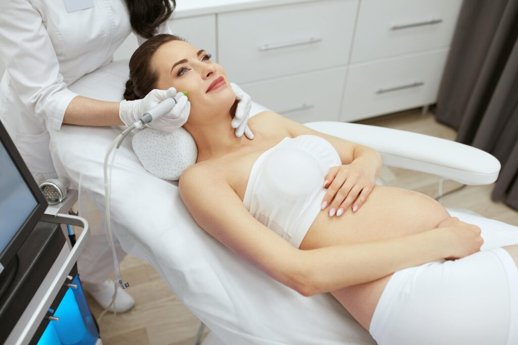 beauty clinic pregnant woman doing intense