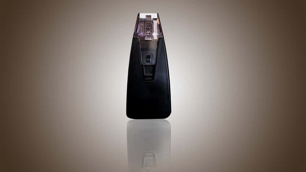 Rf,Microneedling,Black,Handpiece,With,Brown,Background
